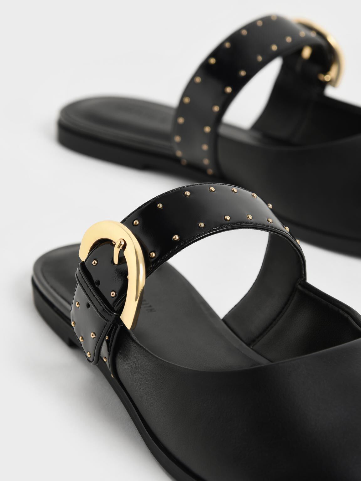 Black studded mules flat top