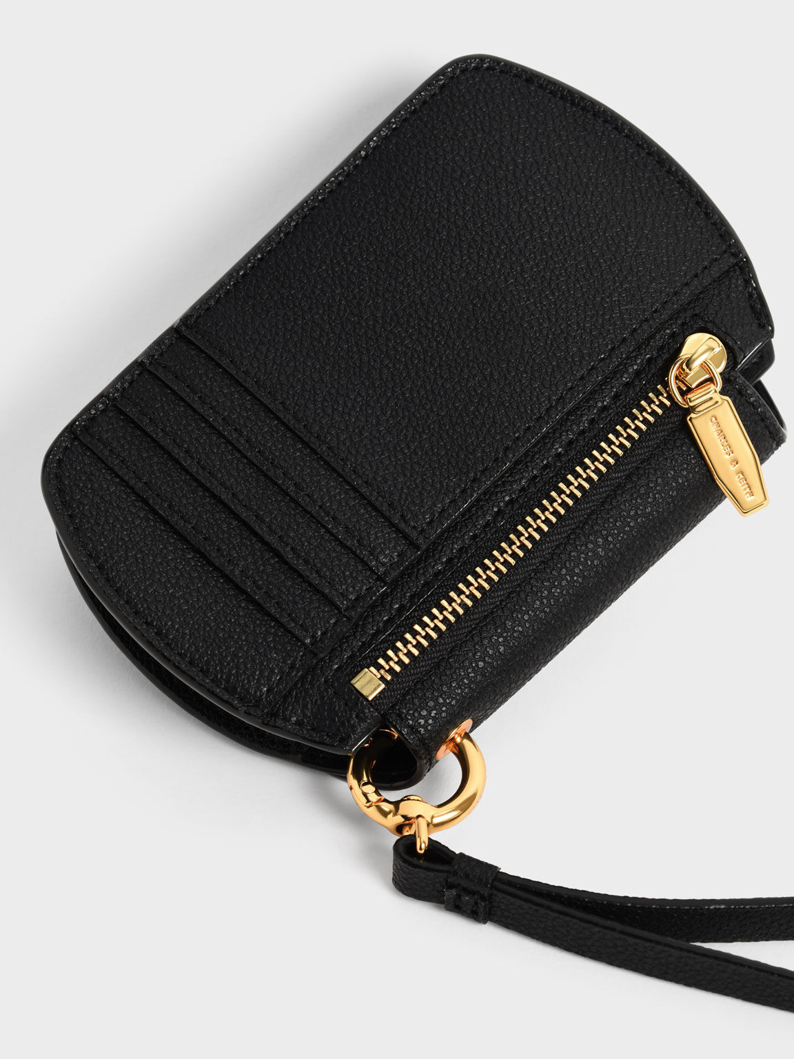 Black Selby Front Flap Curved Wristlet CHARLES KEITH SA