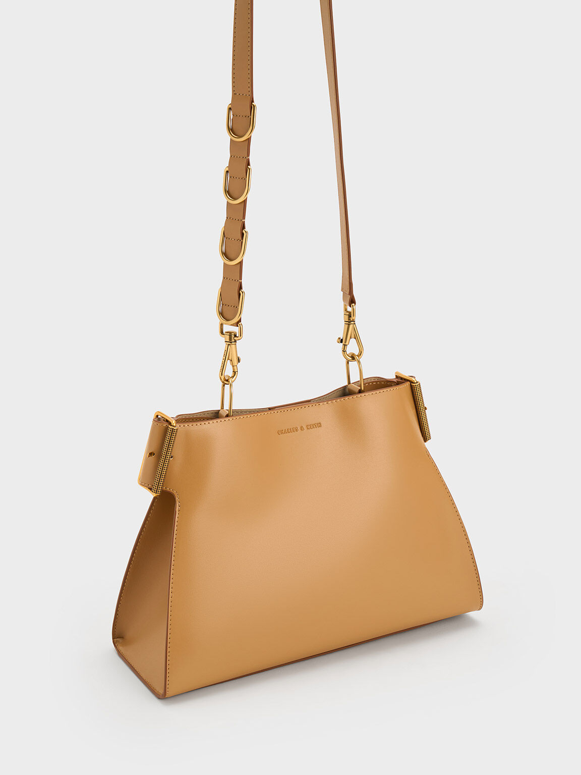 Sand Lexie Side-Buckle Trapeze Shoulder Bag - CHARLES & KEITH SA