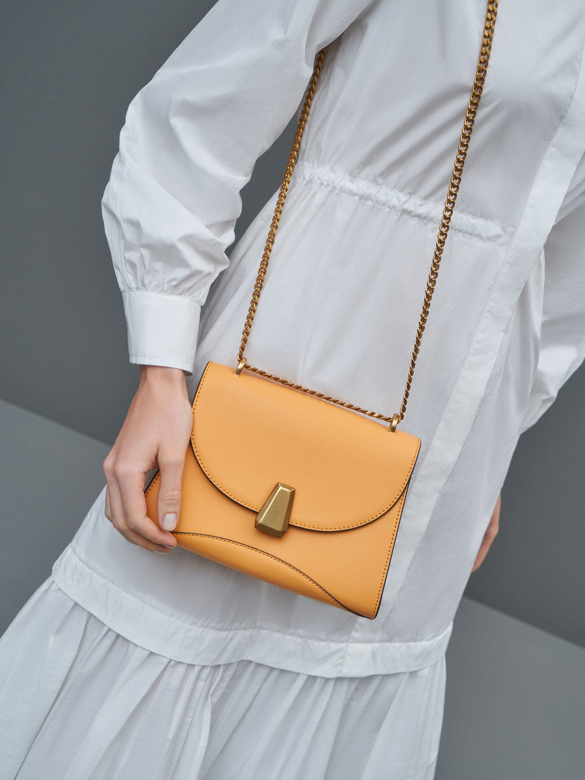 Mustard Metallic Push-Lock Trapeze Shoulder Bag - CHARLES & KEITH SA