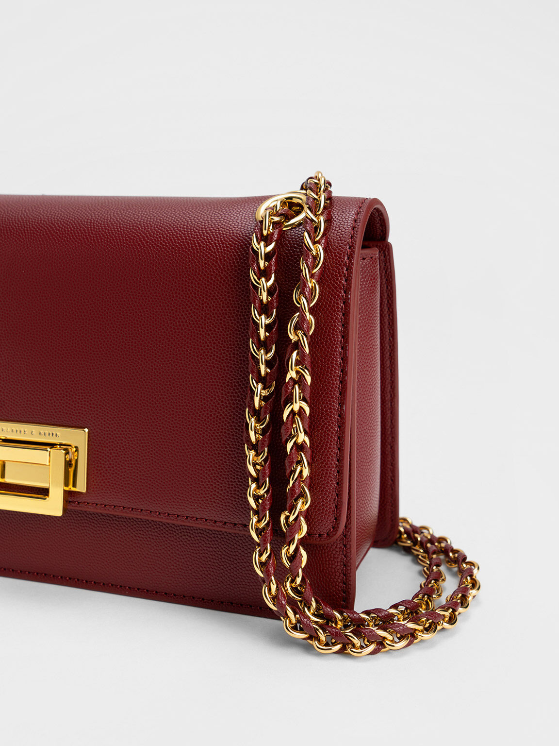 Burgundy Metallic Accent Front Flap Bag CHARLES KEITH SA
