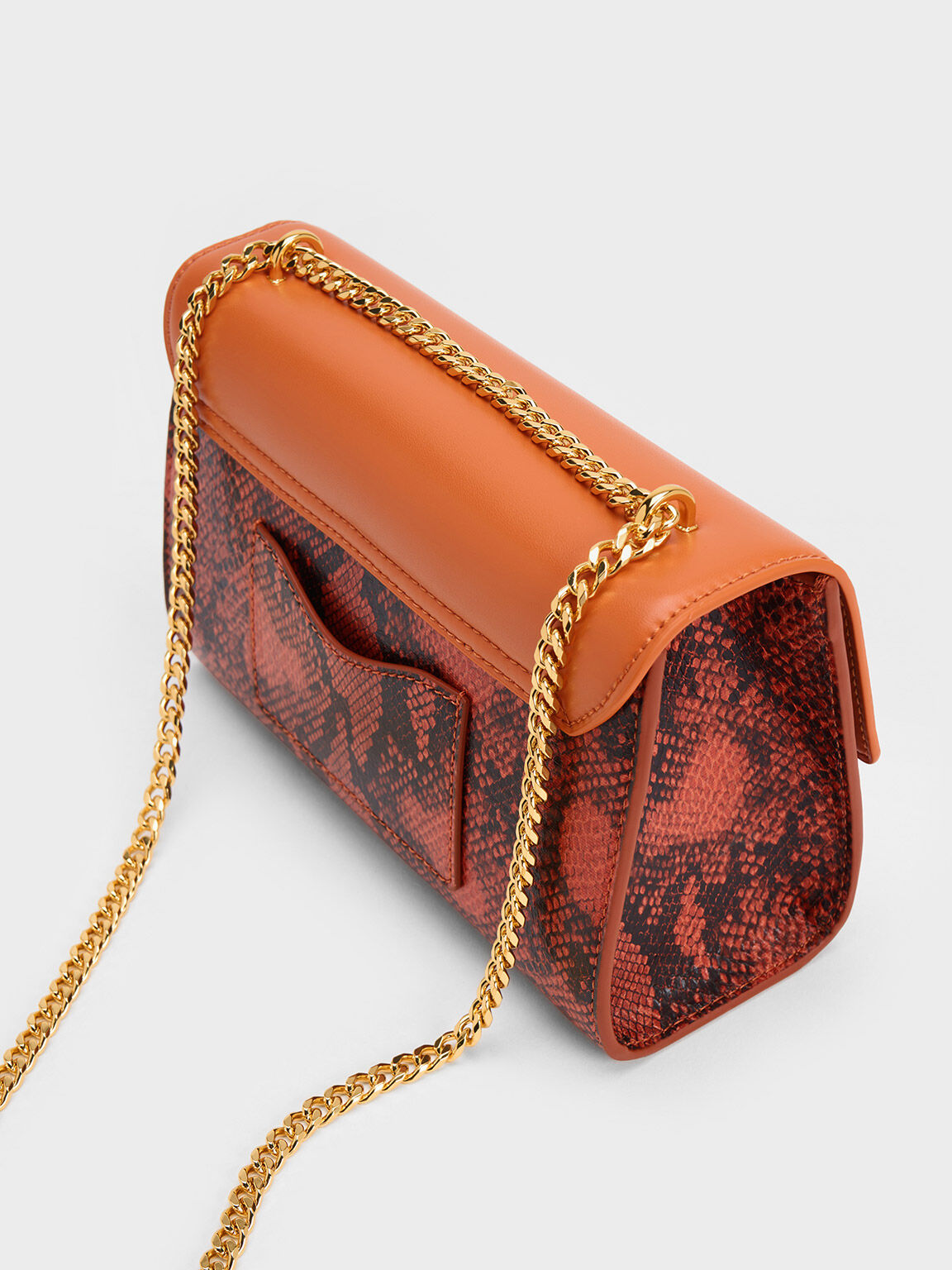 Orange snake outlet print clutch bag
