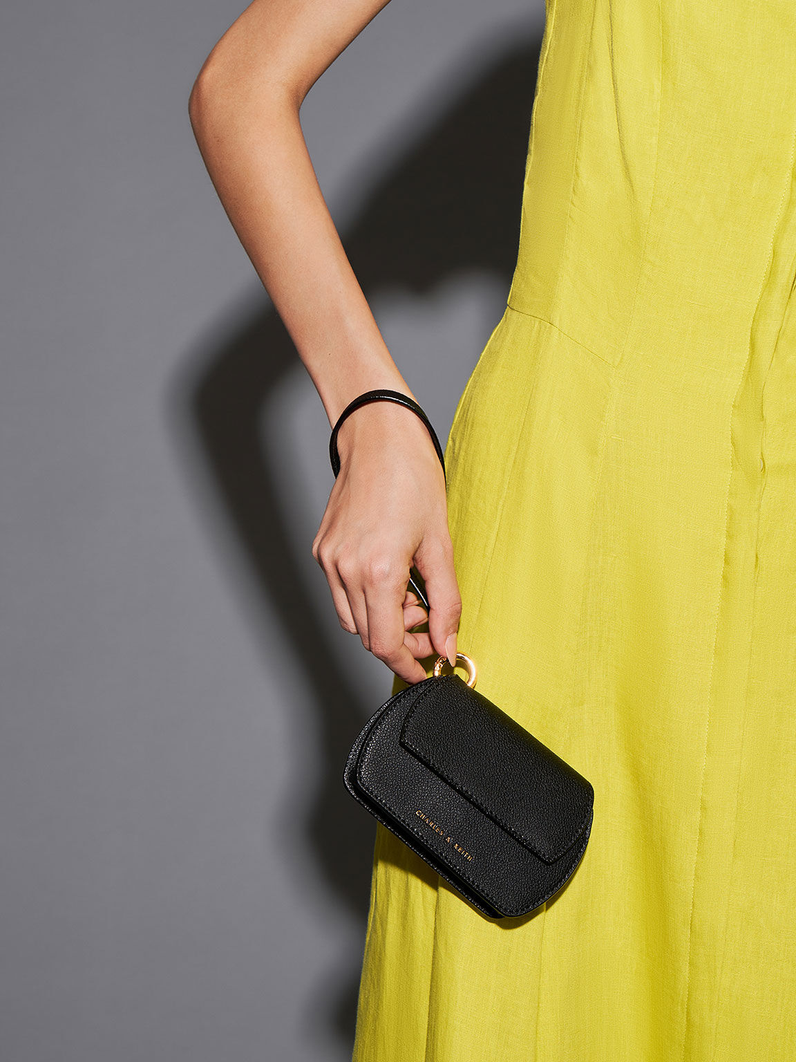 Black Selby Front Flap Curved Wristlet - CHARLES & KEITH SA