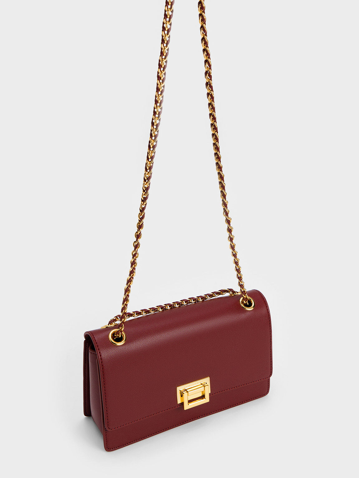 Burgundy Metallic Accent Front Flap Bag CHARLES KEITH SA