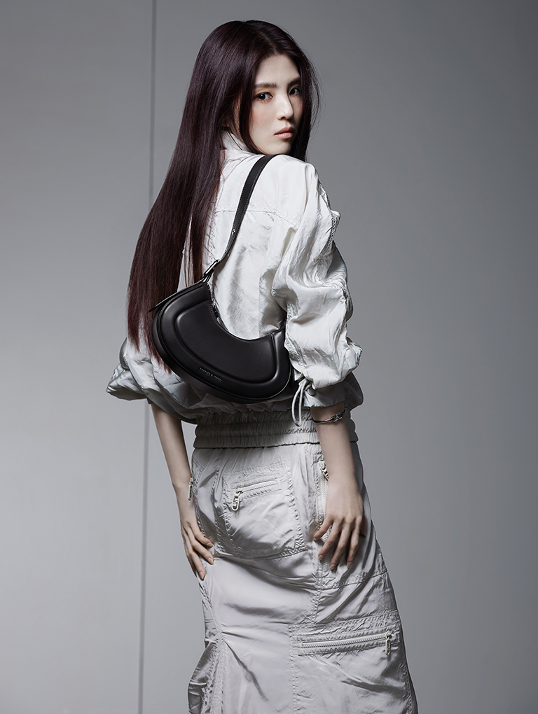 Women’s Petra curved shoulder bag in black, as seen on global brand ambassador Han So Hee - CHARLES & KEITH
