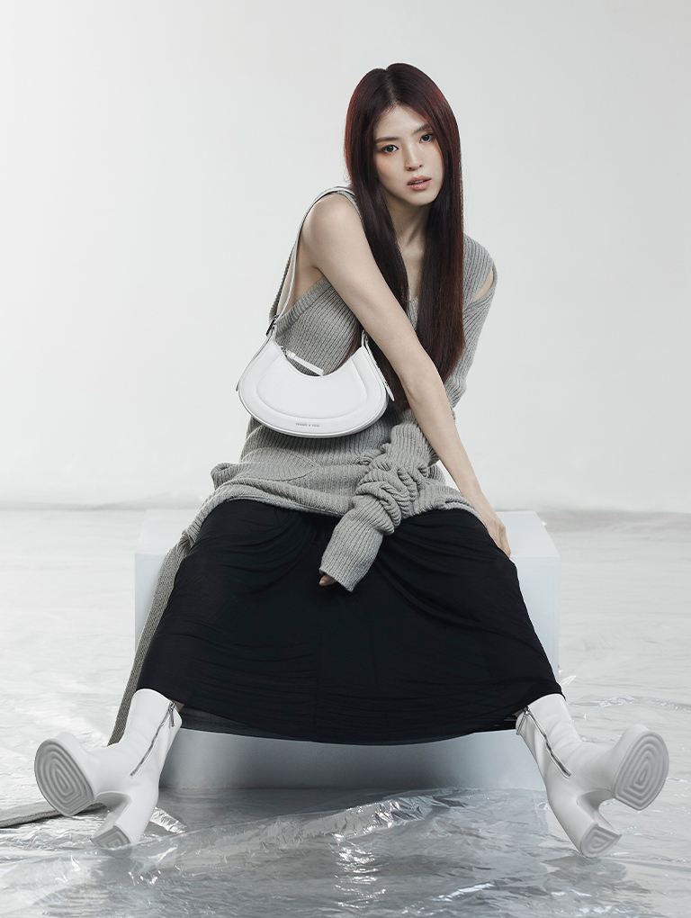 Women’s Petra curved shoulder bag in white, as seen on global brand ambassador Han So Hee - CHARLES & KEITH