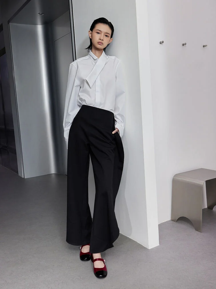 Two-tone Mary Janes paired with a button-up shirt and pants.